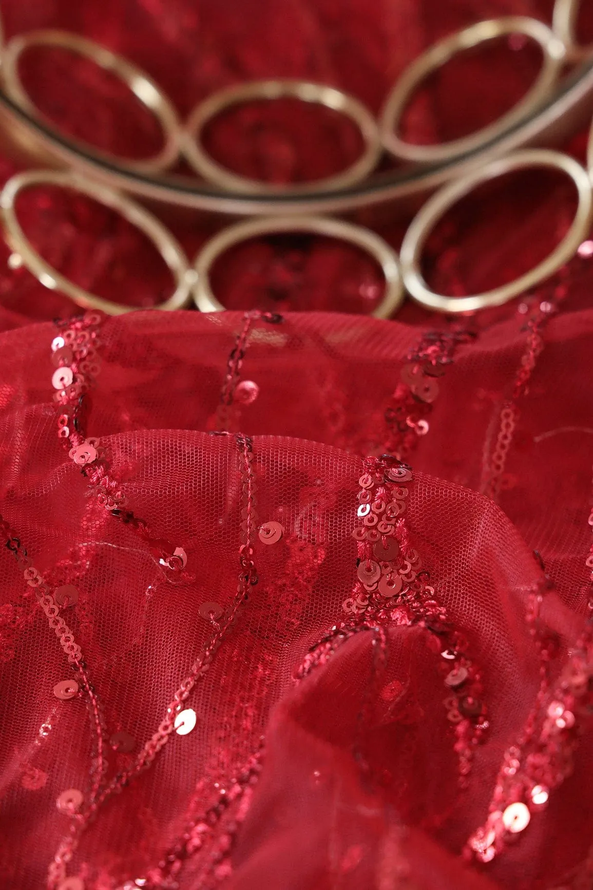 Beautiful Sequins With Red Thread Wavy Embroidery Work On Red Soft Net Fabric