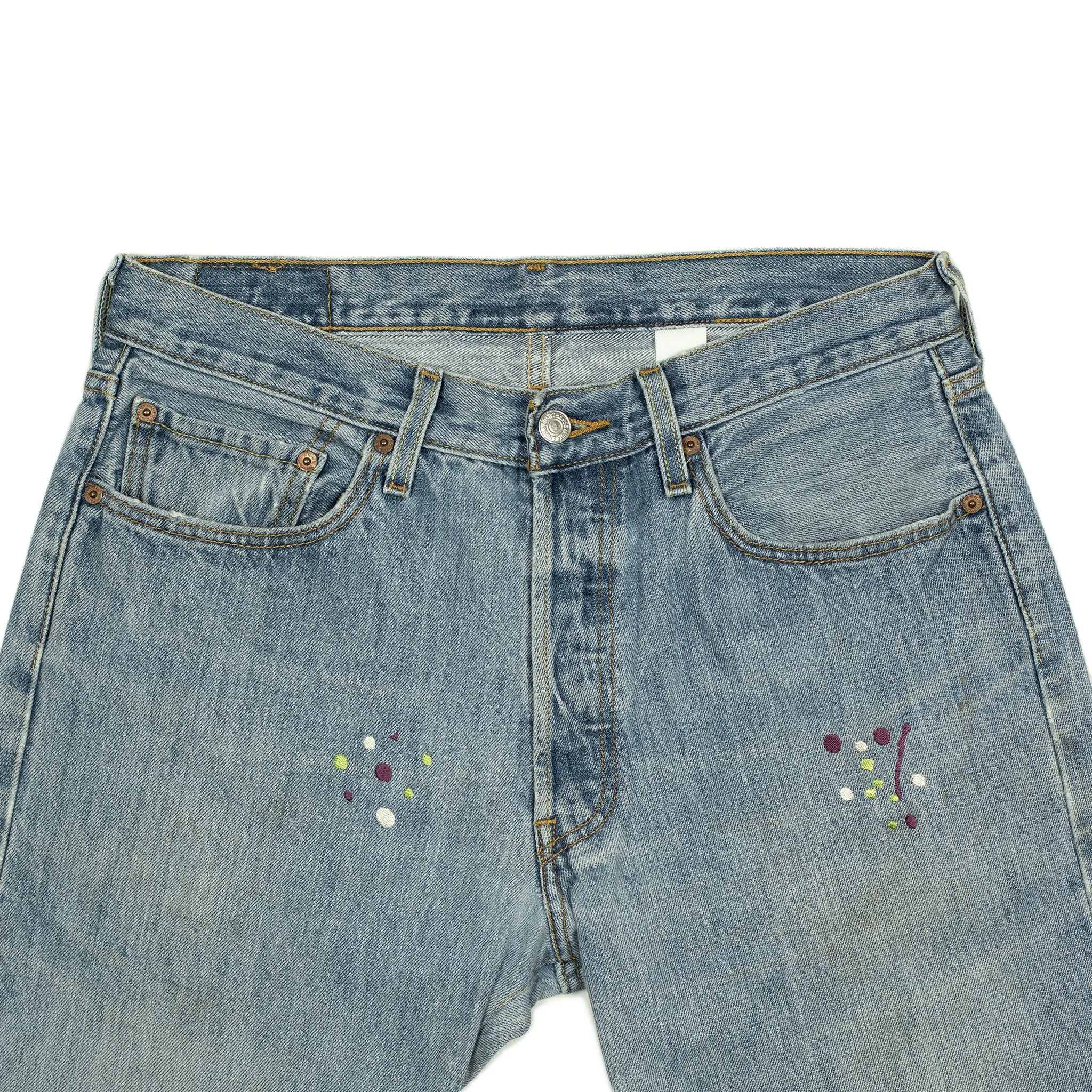 Vintage Levis 501 jeans with embroidered paint splatter, light wash